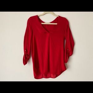 Bright red blouse
